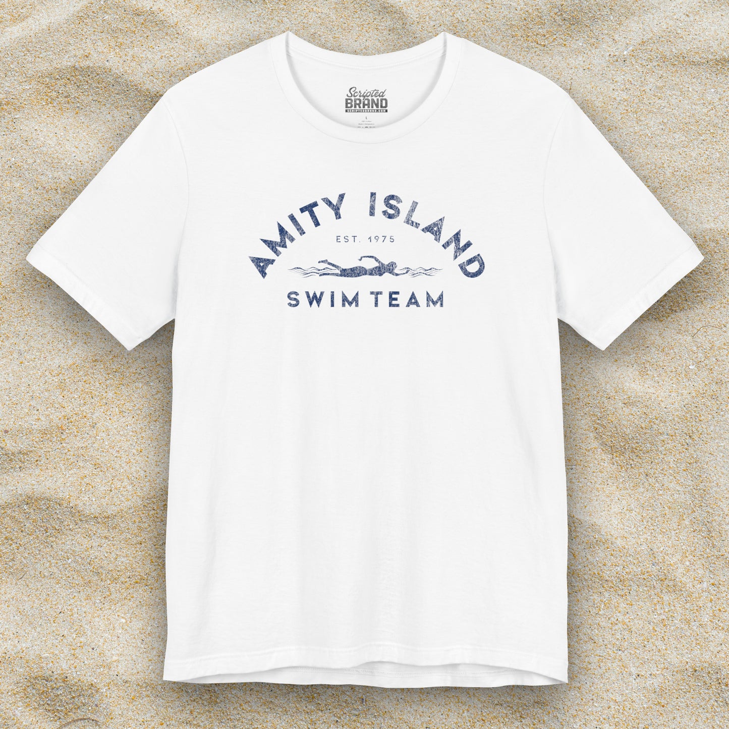 Front view of a white colored Soft unisex Bella+Canvas 3001 short-sleeve t-shirt featuring an Amity Island Swim Team logo graphic, designed by ScriptedBrand, and  inspired by the movie Jaws in a vintage distressed style.