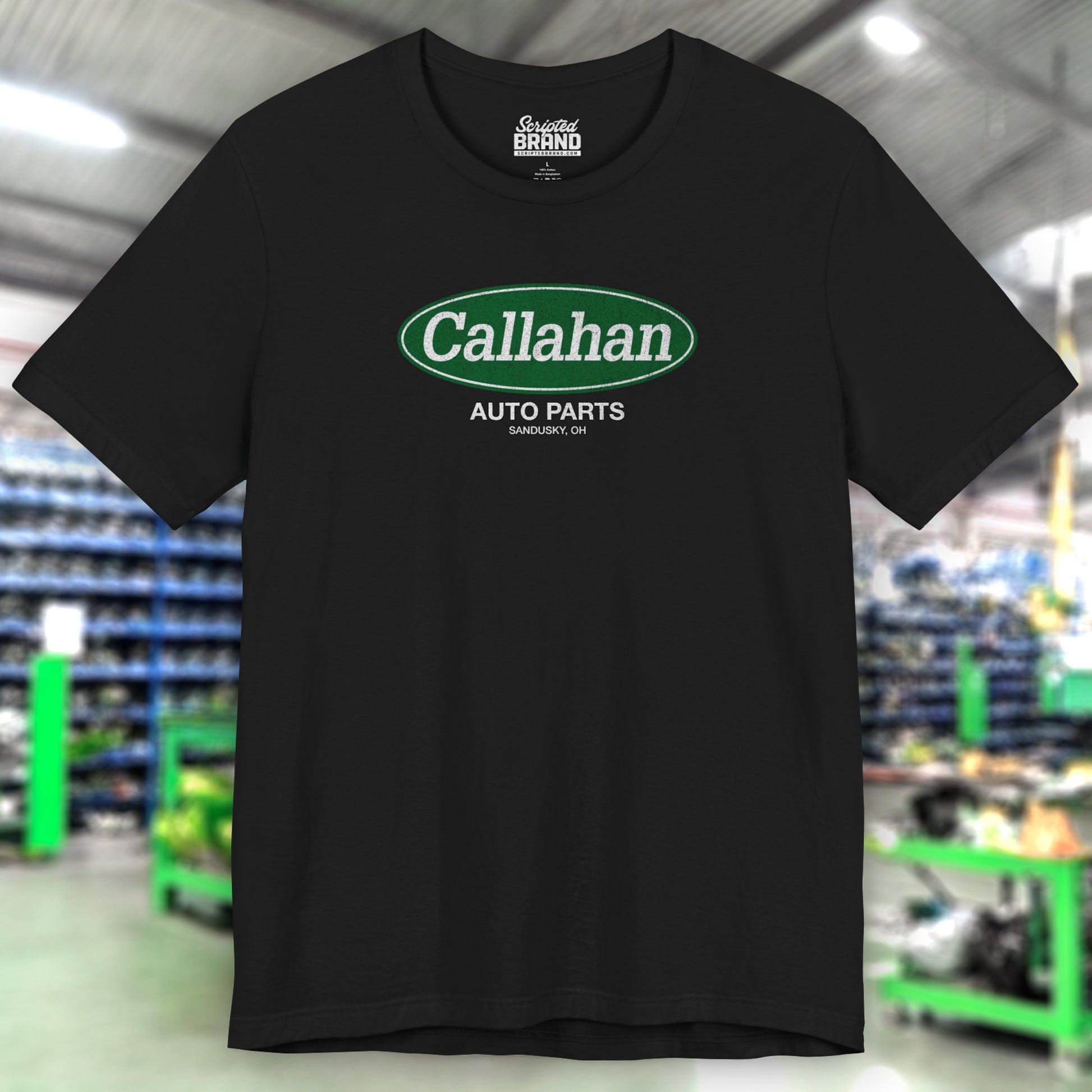 Front view of a Black t-shirt with the Callahan Auto Parts logo from the movie Tommy Boy in a vintage distressed style.