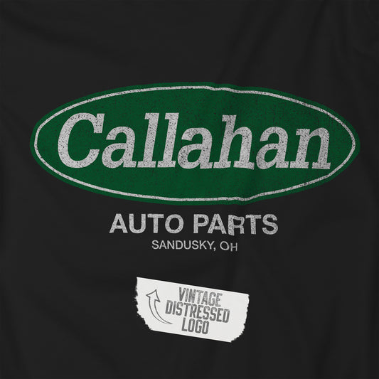 Closeup view of a black t-shirt with the Callahan Auto Parts logo from the movie Tommy Boy in a vintage distressed style.