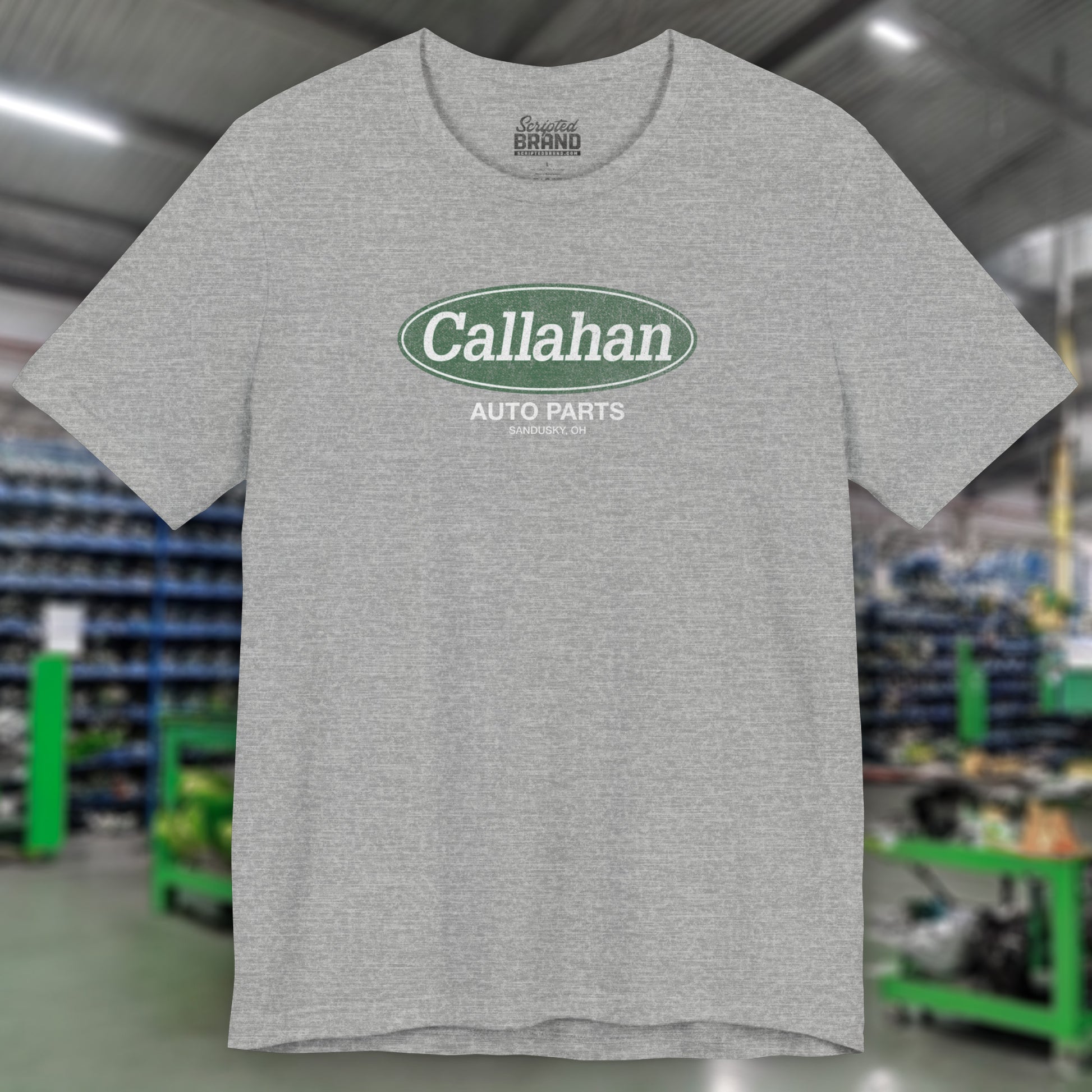 Front view of a Athletic Heather Gray t-shirt with the Callahan Auto Parts logo from the movie Tommy Boy in a vintage distressed style.