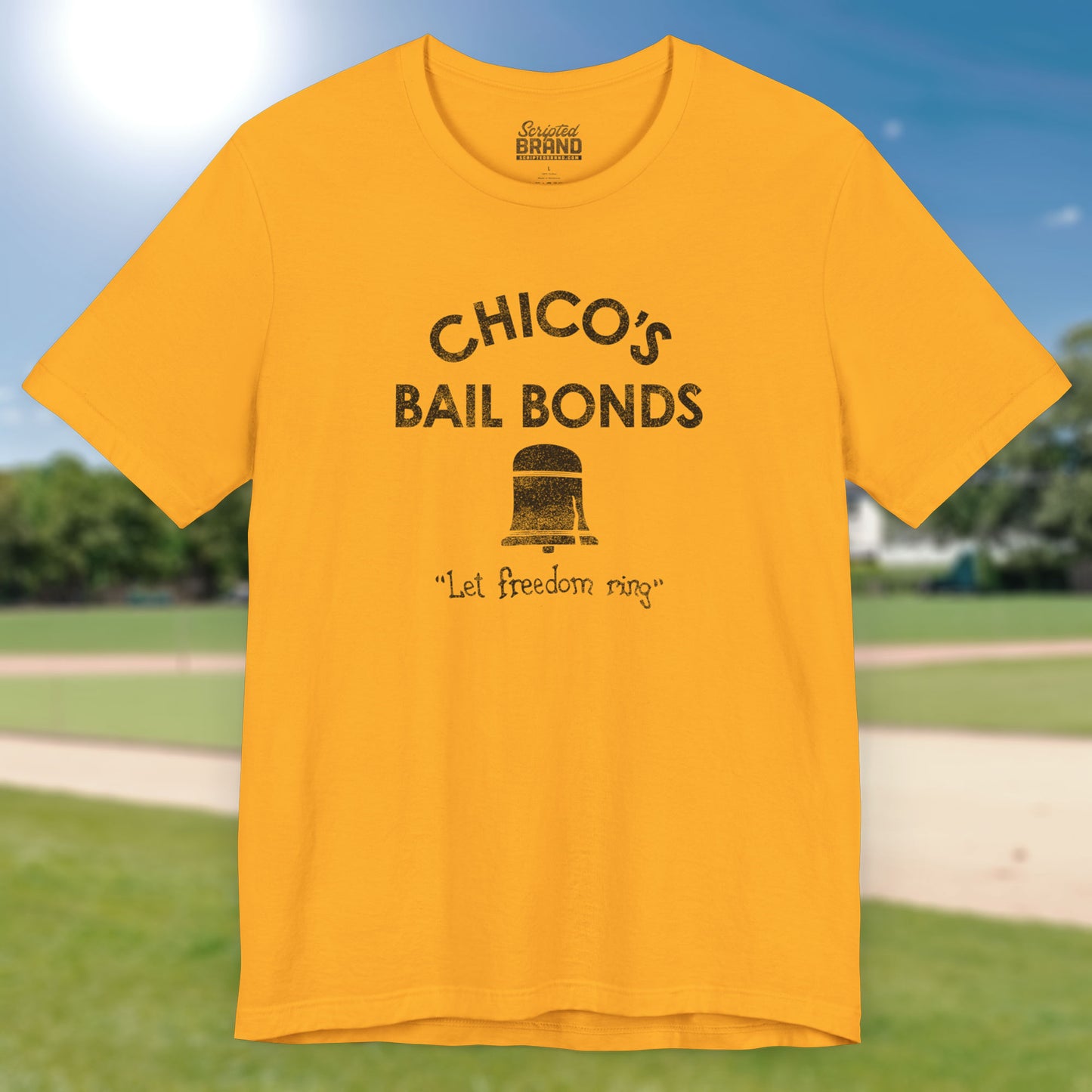Front view of gold t-shirt with distressed Chico’s Bail Bonds logo and “Let freedom ring” slogan from The Bad News Bears movie.