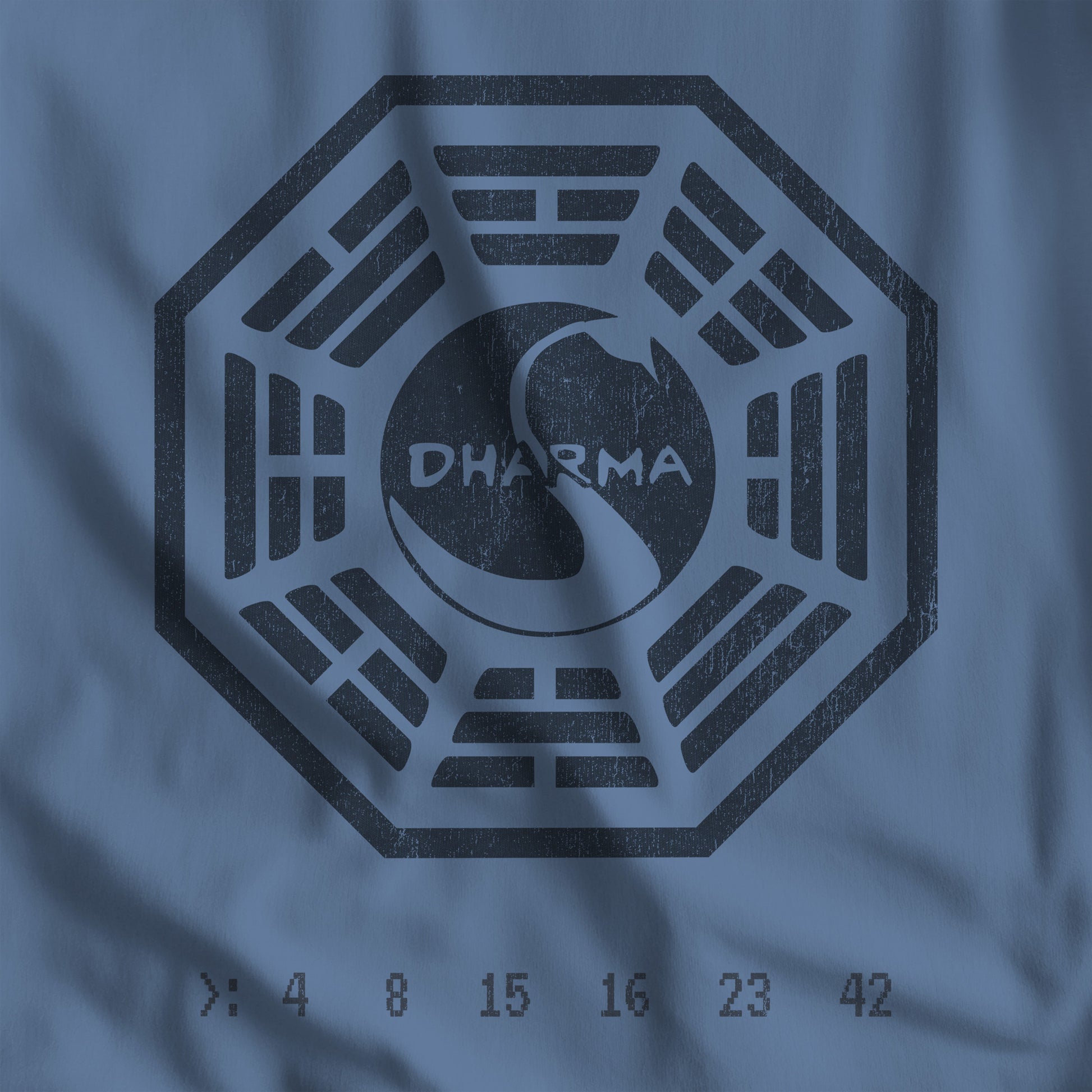 Closeup view of Lavender Blue bella+canvas soft t-shirt featuring a distressed Dharma Initiative swan logo graphic from the TV show LOST.