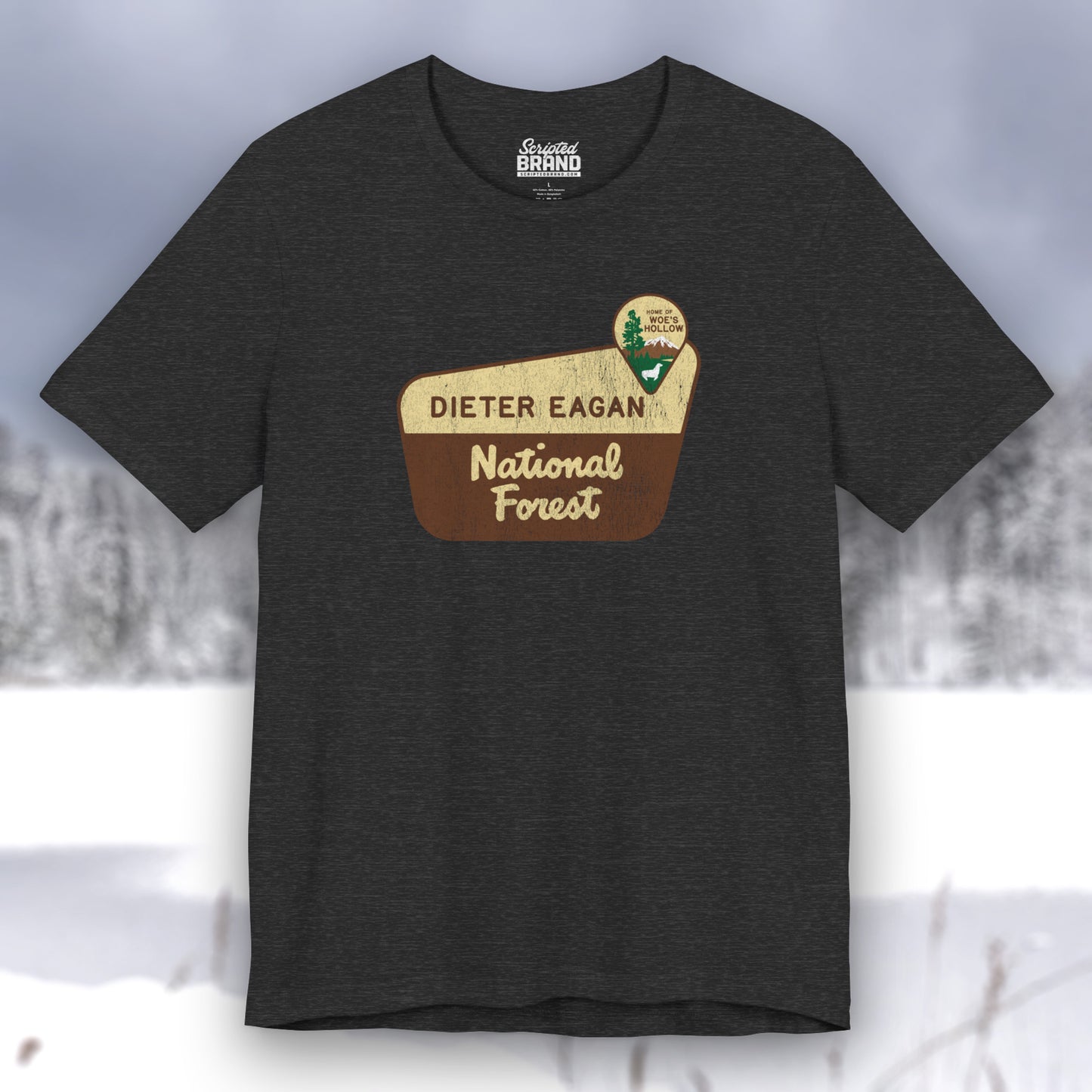 Dark Gray Heather colored soft Bella+Canvas short-sleeve t-shirt with the logo graphic of the Dieter Eagan National Forest inspired by the TV show Severance in a vintage distressed ink-stamped worn-in style.