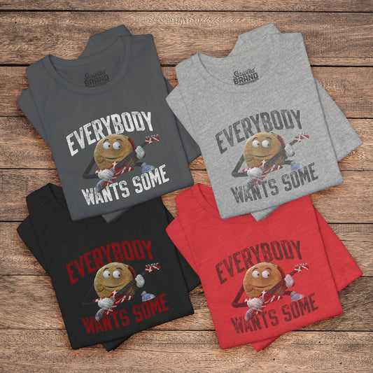 Four folded t-shirts with the phrase EVERYBODY WANTS SOME and a graphic of the guitar playing hamburger from the movie Better Off Dead in a vintage style.