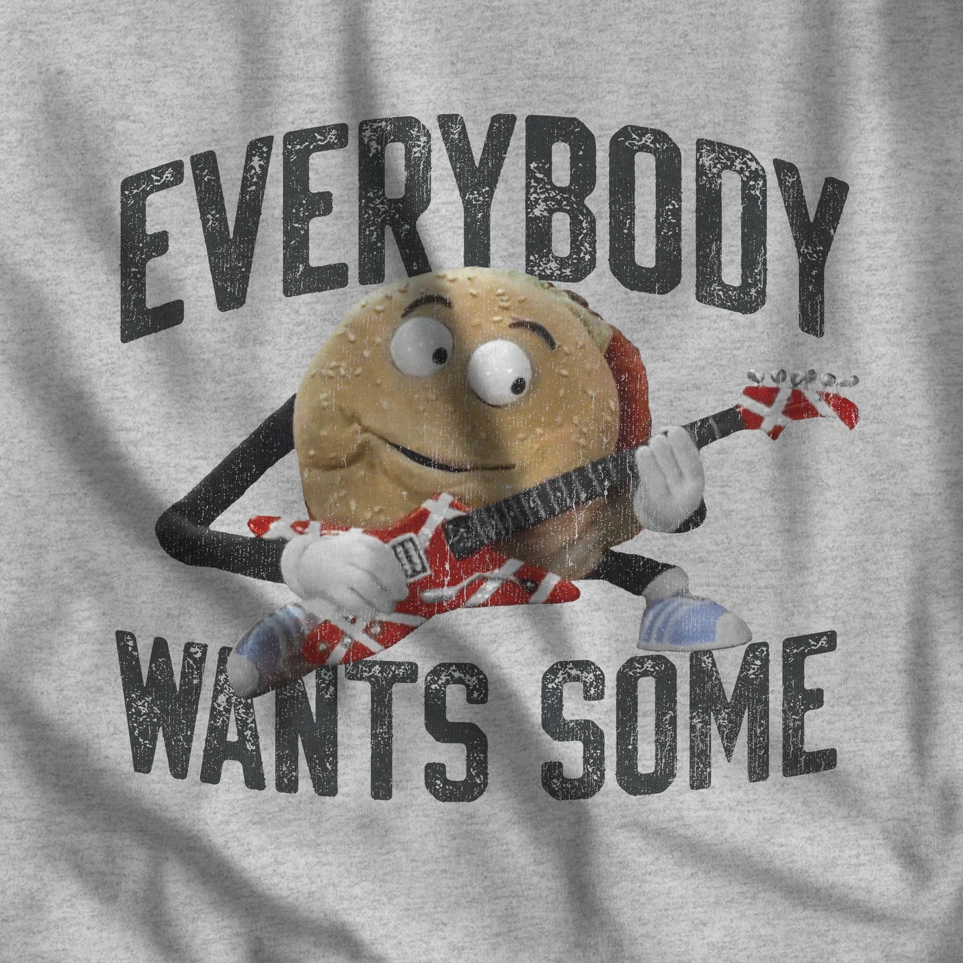 Closeup of Heather Gray Bella Canvas Tee featuring Better Off Dead movie vintage Van Halen guitar Everybody Wants Some graphic with pig burger.