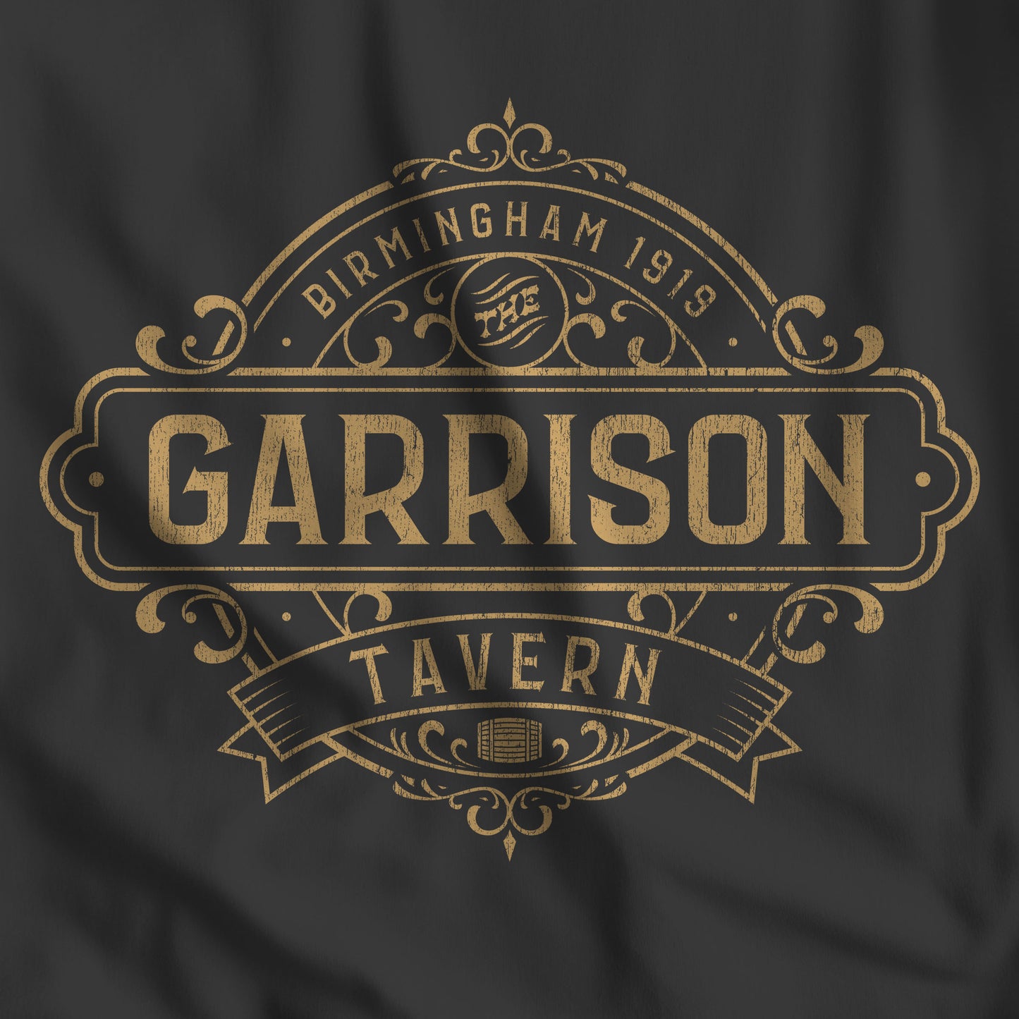 Closeup of a black t-shirt featuring the Garrison Tavern Graphic inspired by the TV show and movie Peaky Blinders.