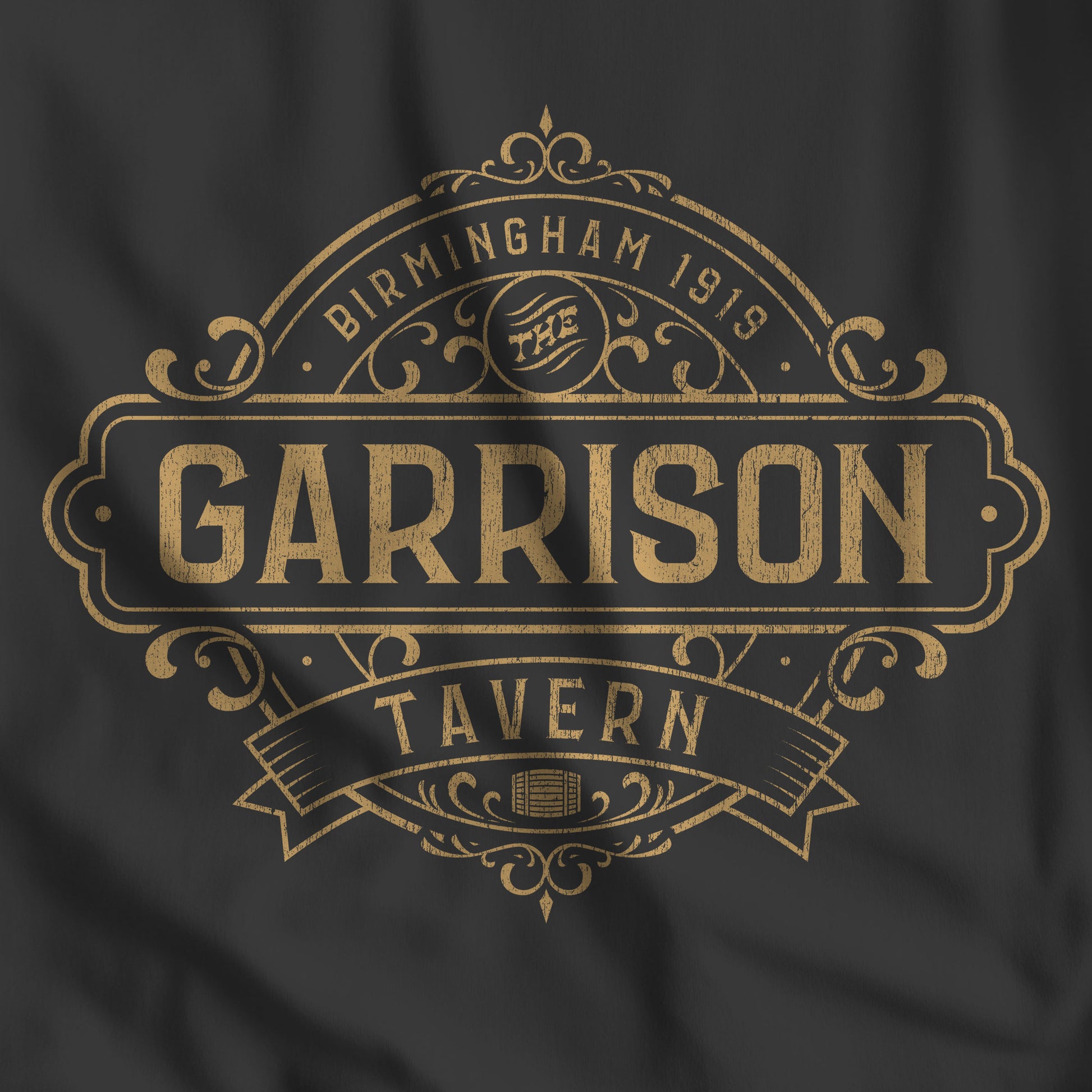 Closeup of a black t-shirt featuring the Garrison Tavern Graphic inspired by the TV show and movie Peaky Blinders.