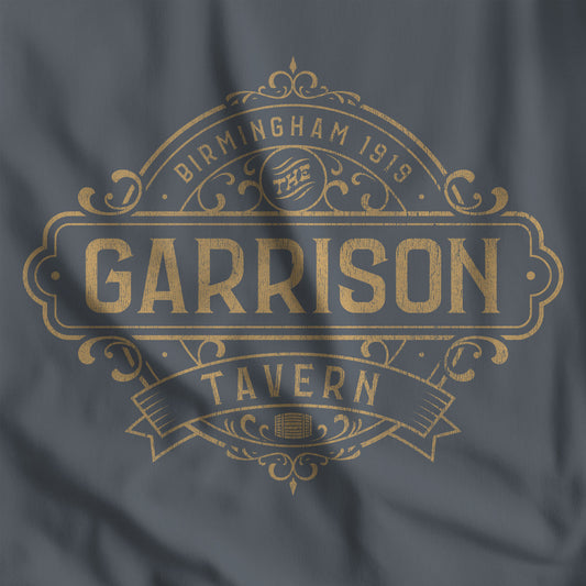 Closeup of a dark gray t-shirt featuring the Garrison Tavern Graphic inspired by the TV show and movie Peaky Blinders.