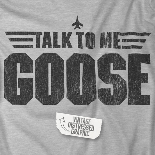Closeup view of an athletic heather grey soft unisex Bella+Canvas 3001 short-sleeve t-shirt featuring a graphic designed by ScriptedBrand in a vintage distressed style with the text TALK TO ME GOOSE, inspired by the Movie Top Gun.
