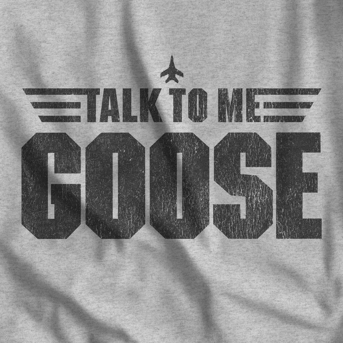 Closeup of Heather gray tee with vintage distressed black Talk To Me Goose, Top Gun-inspired graphic