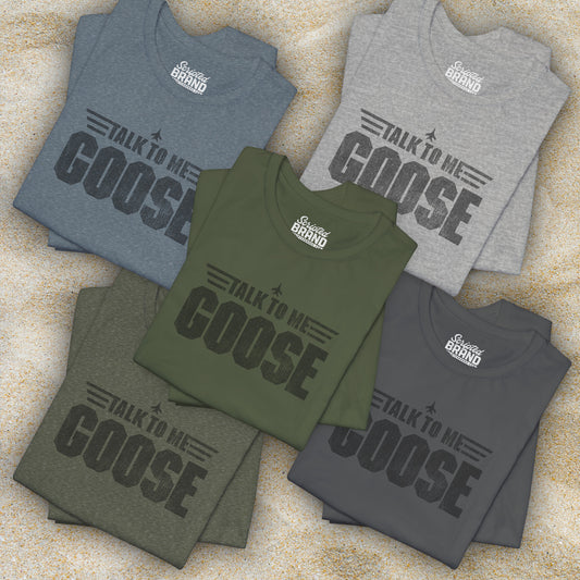 Group of 5 folded soft unisex Bella+Canvas 3001 short-sleeve t-shirts featuring a graphic designed by ScriptedBrand in a vintage distressed style with the text TALK TO ME GOOSE, inspired by the Movie Top Gun.