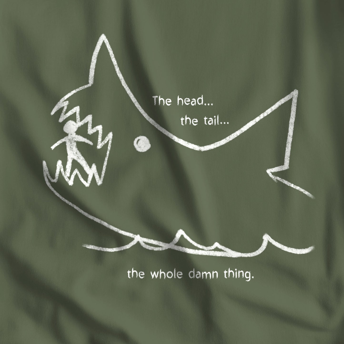 Closeup of Military Green colored Bella+Canvas t-shirt with the chalkboard drawing of a shark eating a person, drawn by Quint in the movie Jaws.
