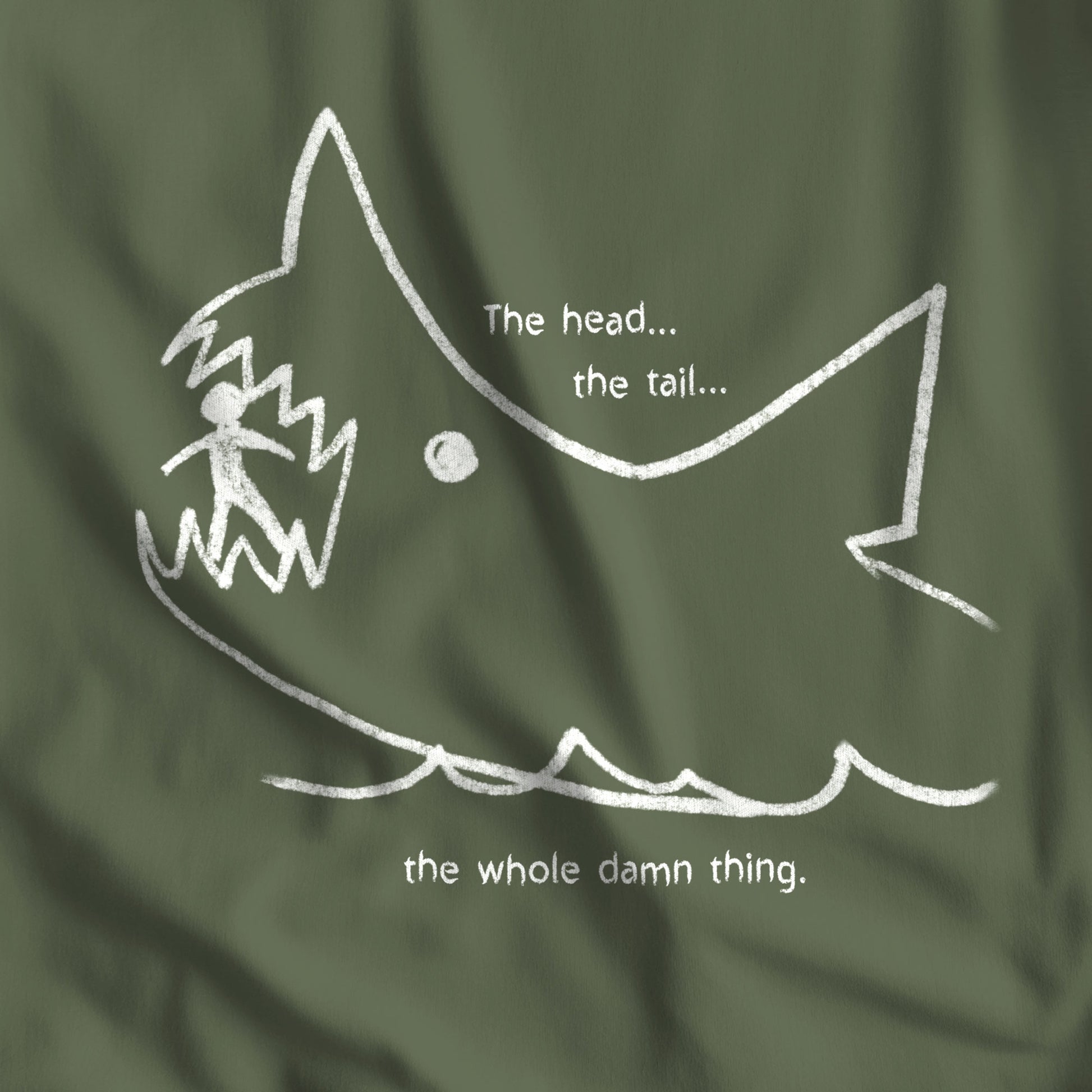 Closeup of Military Green colored Bella+Canvas t-shirt with the chalkboard drawing of a shark eating a person, drawn by Quint in the movie Jaws.