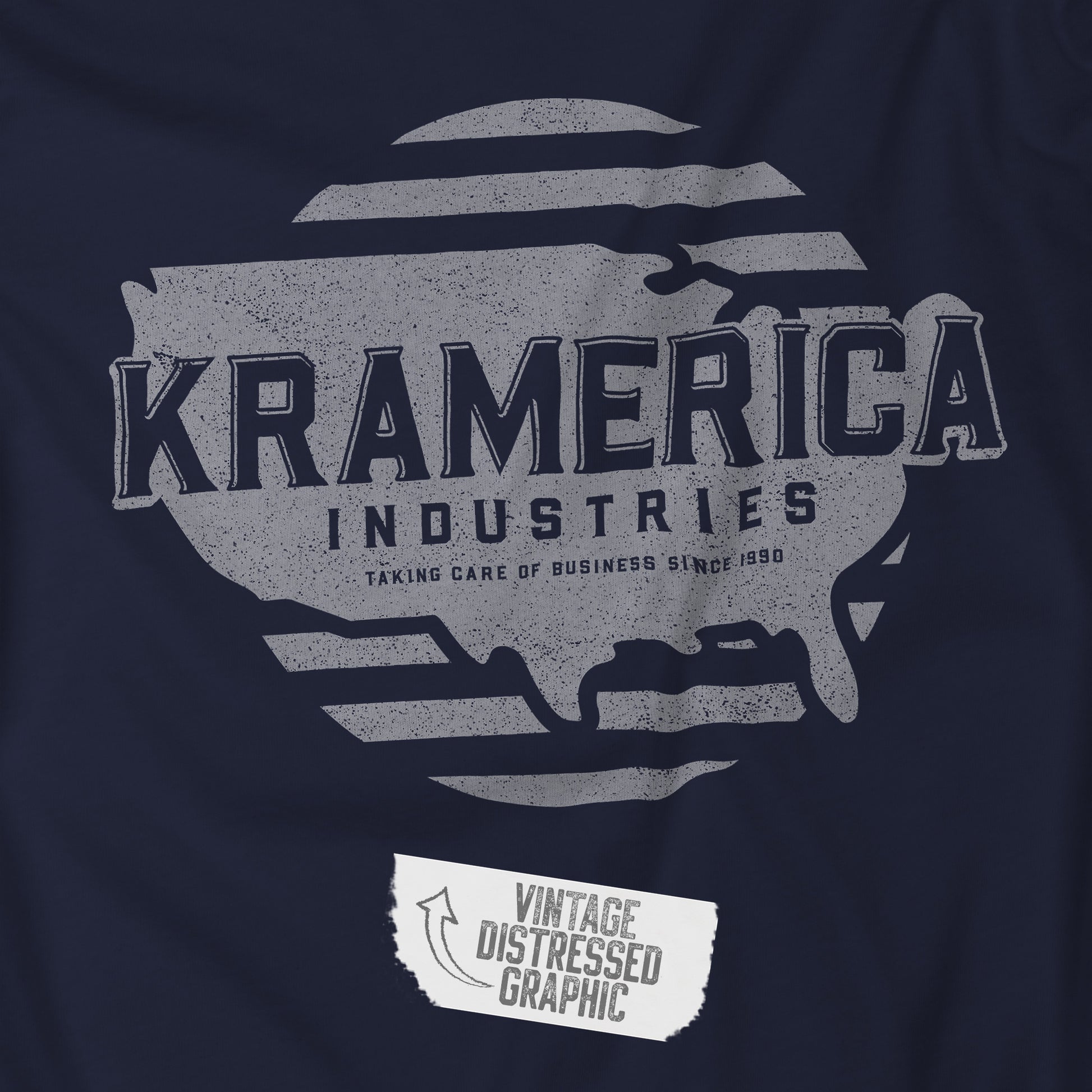 Closeup view of a Navy blue t-shirt featuring a Kramerica logo graphic inspired by the TV show Seinfeld in a vintage distressed style.