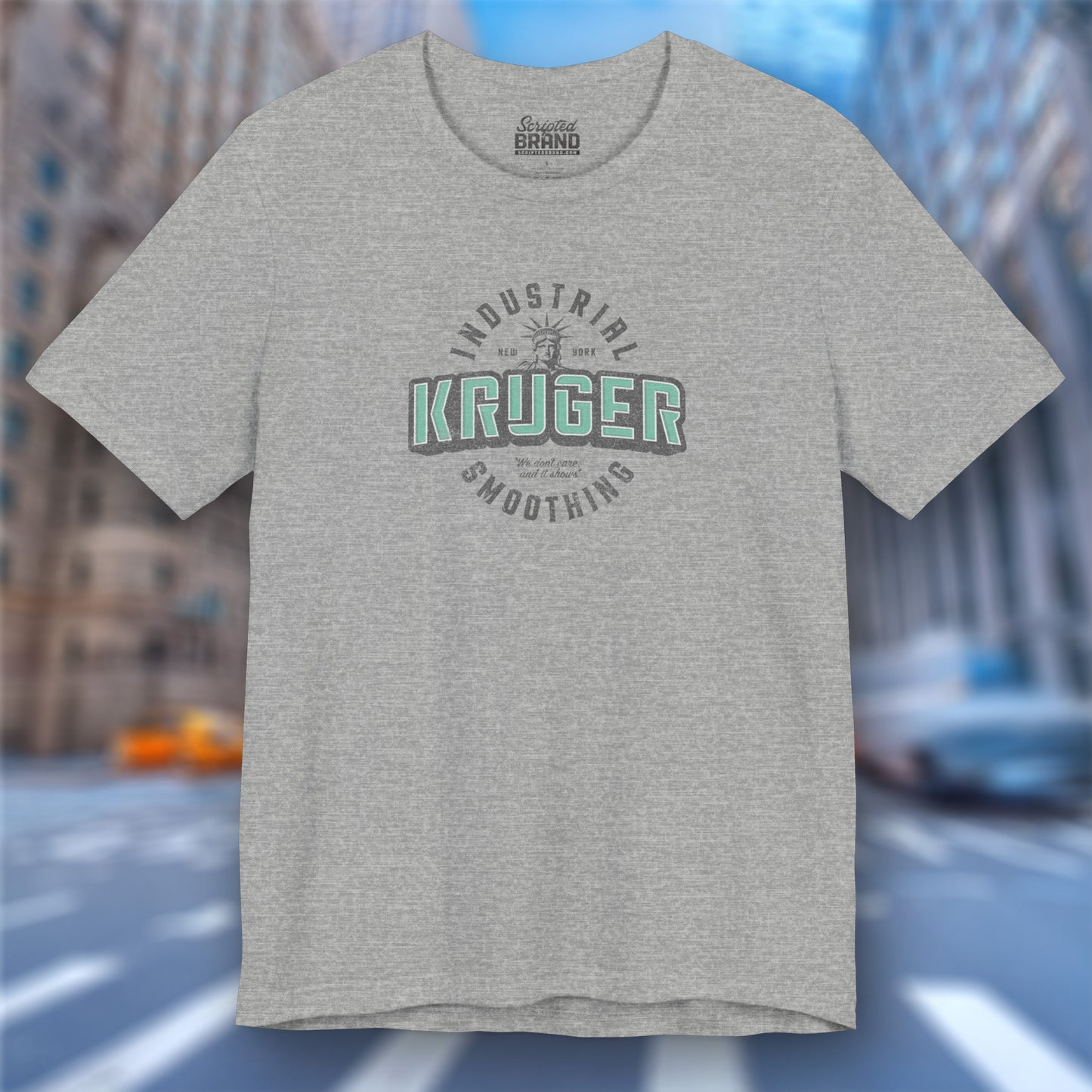 Front view of an athletic heather grey colored Soft unisex Bella+Canvas 3001 short-sleeve t-shirt featuring a Kruger Industrial Smoothing logo graphic in a vintage distressed style, designed by ScriptedBrand, and  inspired by the TV show Seinfeld.