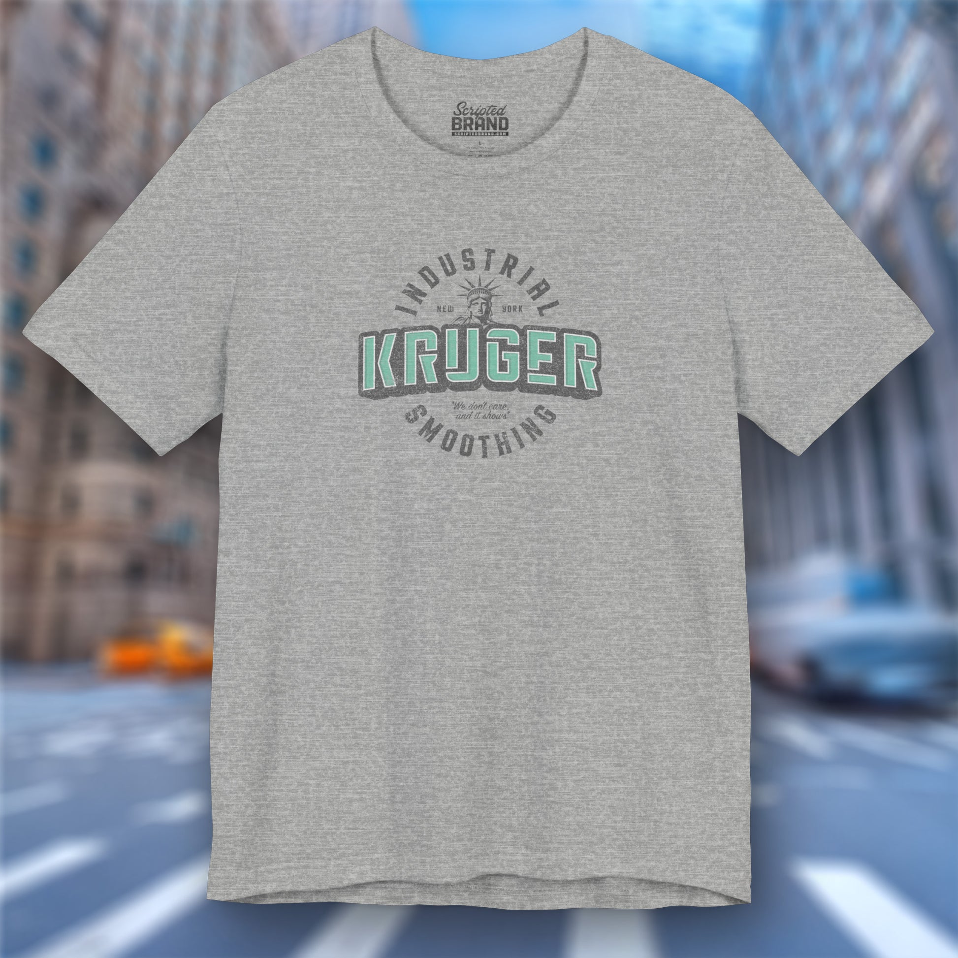 Front view of an athletic heather grey colored Soft unisex Bella+Canvas 3001 short-sleeve t-shirt featuring a Kruger Industrial Smoothing logo graphic in a vintage distressed style, designed by ScriptedBrand, and  inspired by the TV show Seinfeld.