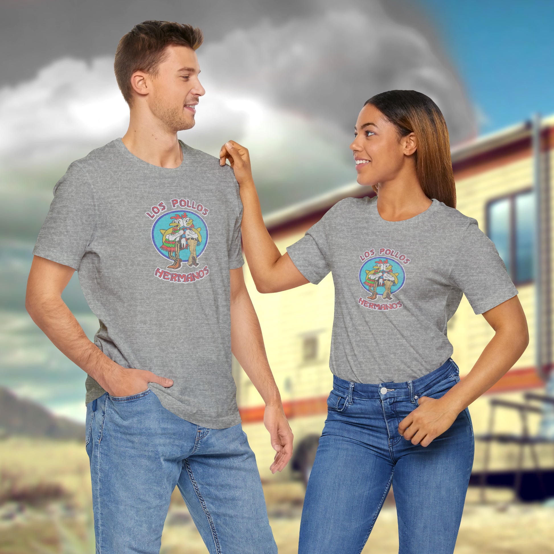 3 models wearing heather gray Soft short-sleeve Bella+Canvas 3001 t-shirts featuring the Los Pollos Hermanos logo graphic from the TV show Breaking Bad in a vintage distressed style.
