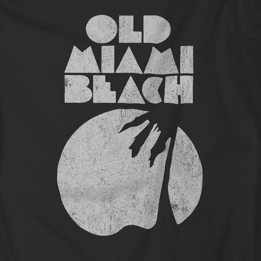 Closeup of Black Bella+Canvas 3001 T-shirt with distressed “Old Miami Beach” graphic, inspired by Julia Garner’s shirt in Weapons movie.