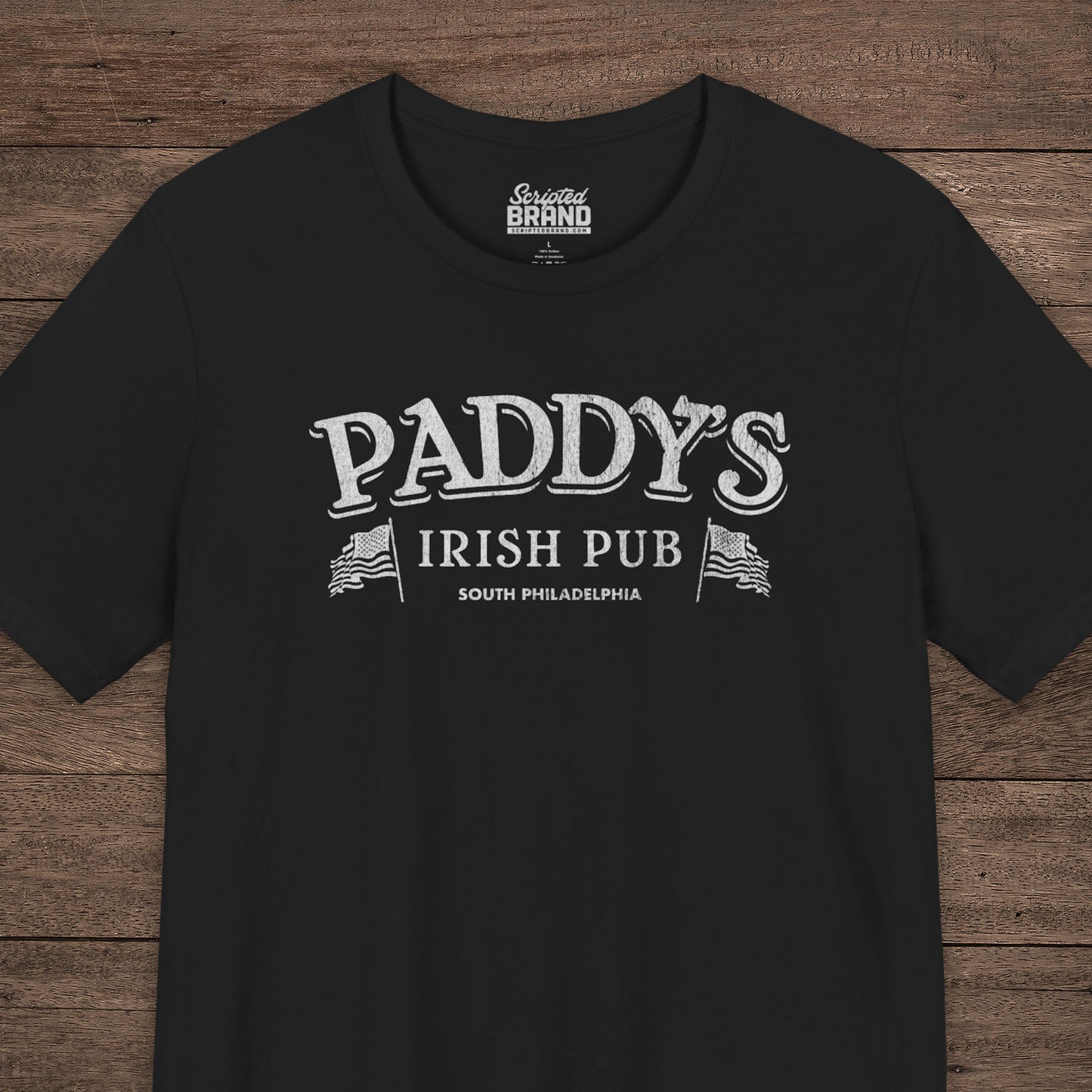 Black t-shirt with vintage Paddy's Pub Irish Bar graphic inspired by It’s Always Sunny in Philadelphia.