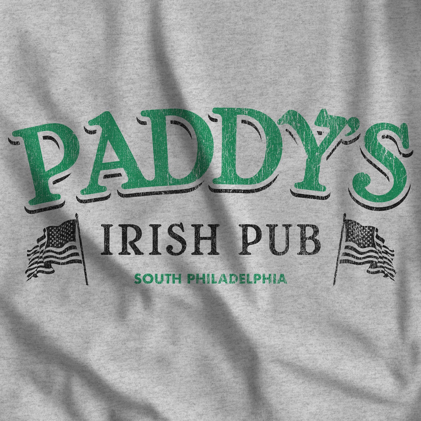 Closeup of Heather Grey t-shirt with vintage Paddy's Pub Irish Bar graphic inspired by the show It’s Always Sunny in Philadelphia