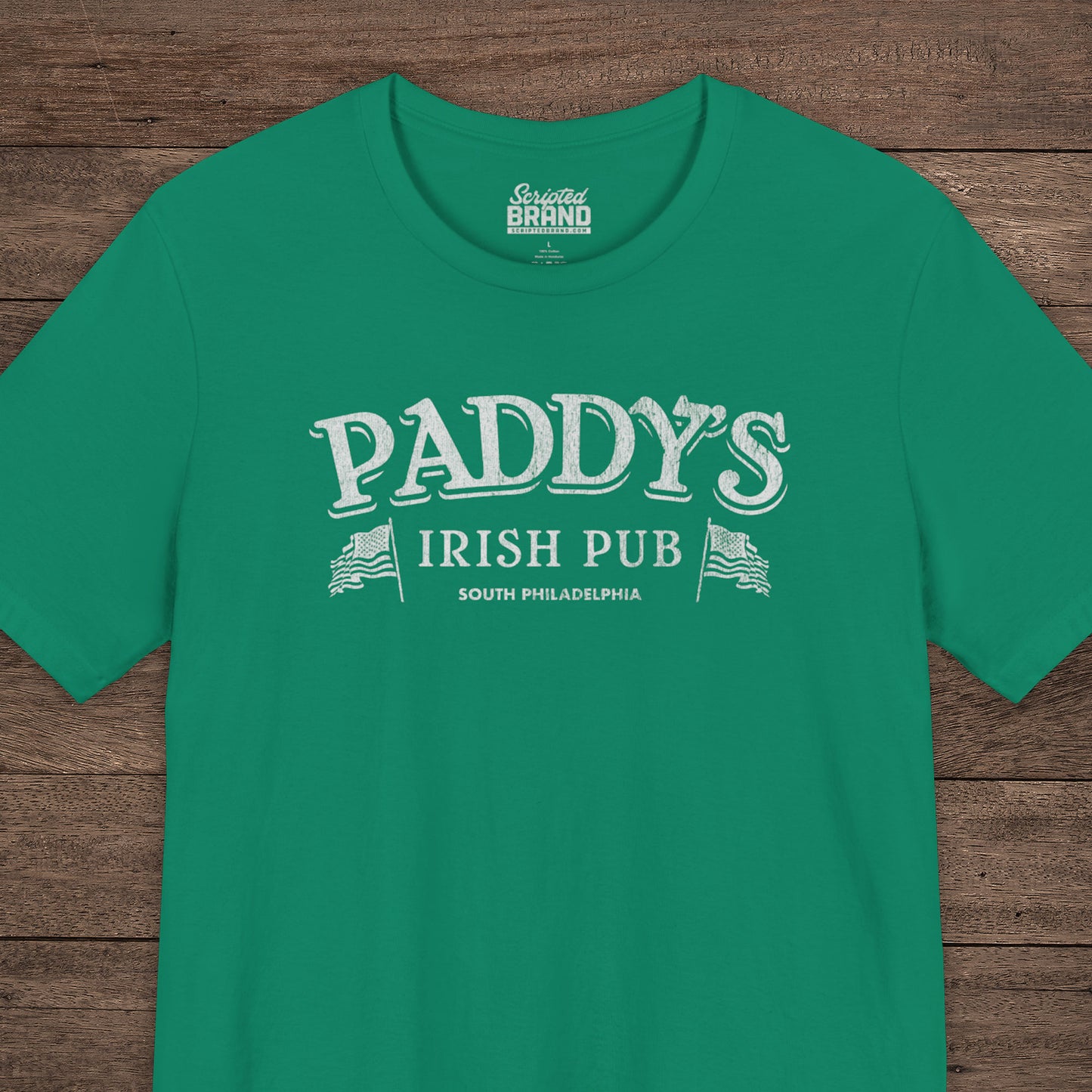 Green t-shirt with vintage Paddy's Pub Irish Bar graphic inspired by It’s Always Sunny in Philadelphia.