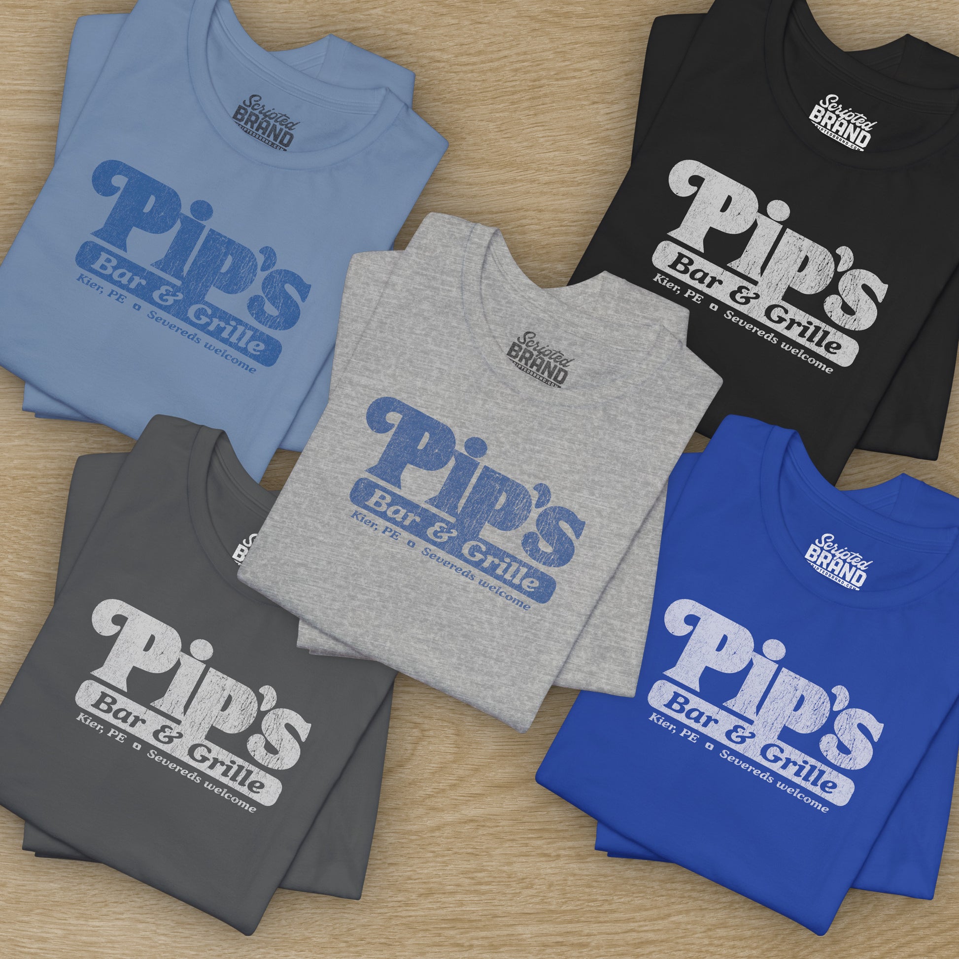 Group of 5 Soft Bella+Canvas shirtsleeve t-shirts with the Pips Bar and Grill logo from the TV show Severance in a vintage distressed ink-stamped worn-in style.
