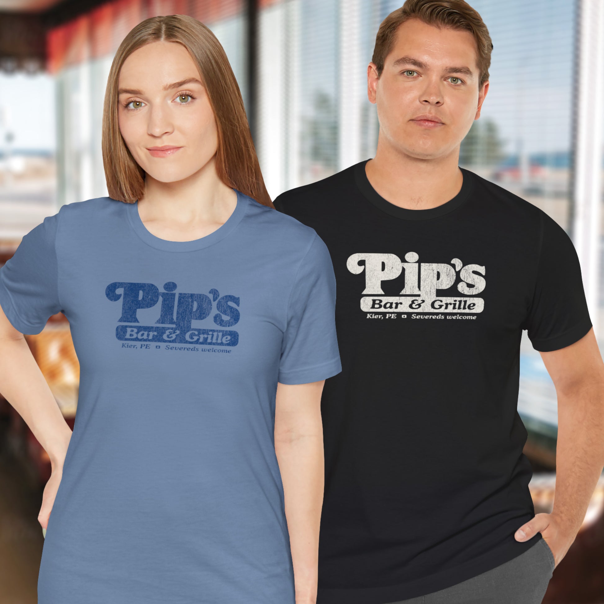 Two people wearing Bella+Canvas t-shirts with the Pips Bar and Grill logo from the TV show Severance in a vintage distressed style.