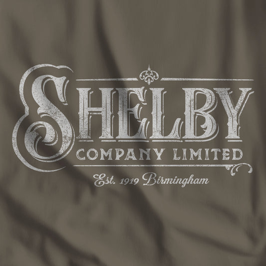 Closeup of army colored Bella+Canvas 3001 t-shirt featuring a vintage Shelby Company Limited logo from Peaky Blinders.