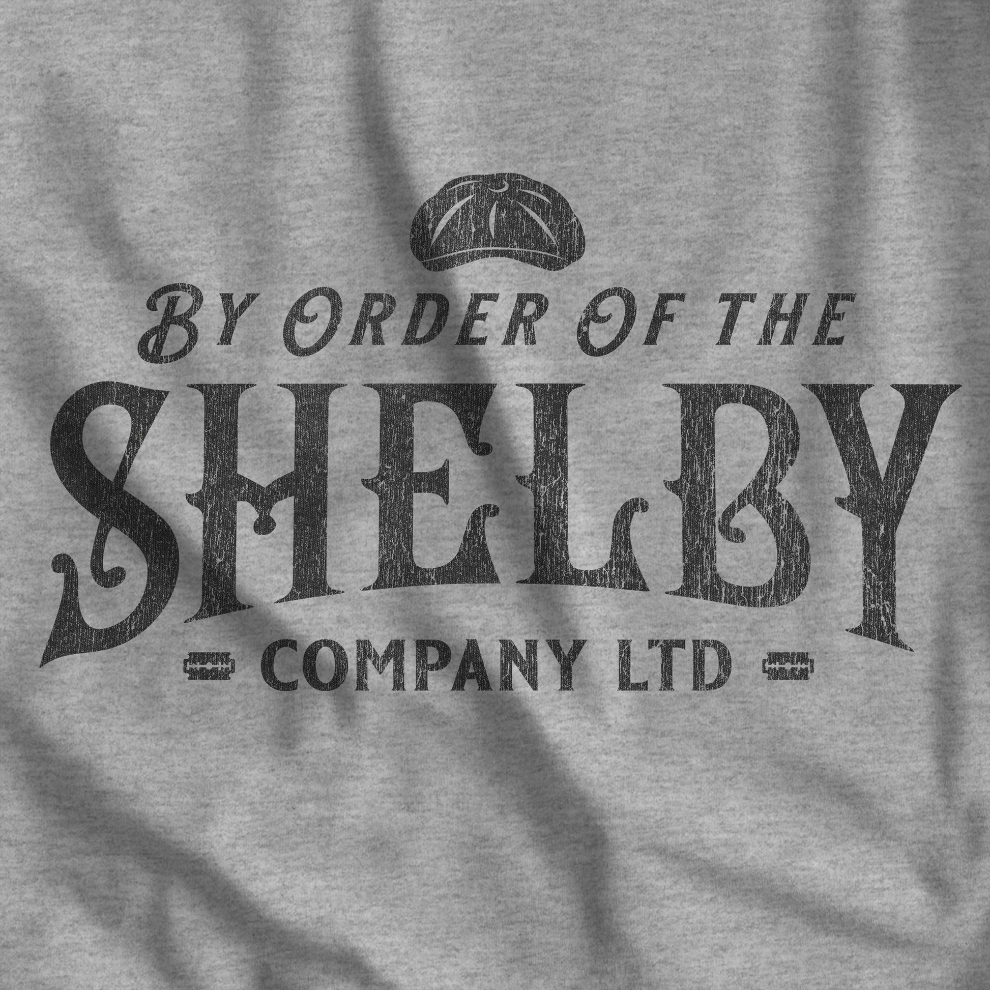 Closeup of heather gray Bella+Canvas 3001 t-shirt featuring a Shelby Company Limited logo graphic from Peaky Blinders.
