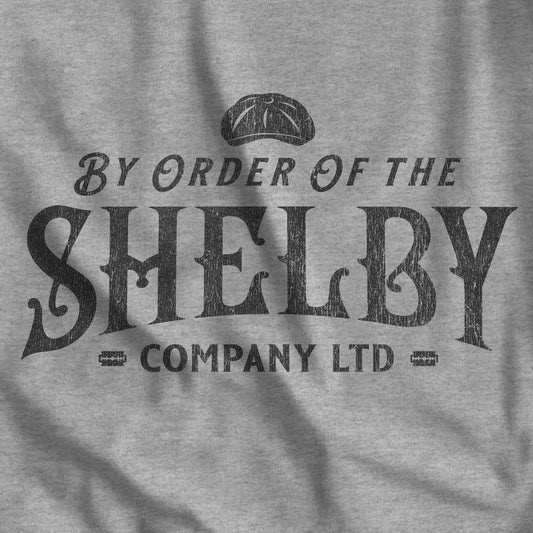 Closeup of heather gray Bella+Canvas 3001 t-shirt featuring a Shelby Company Limited logo graphic from Peaky Blinders.