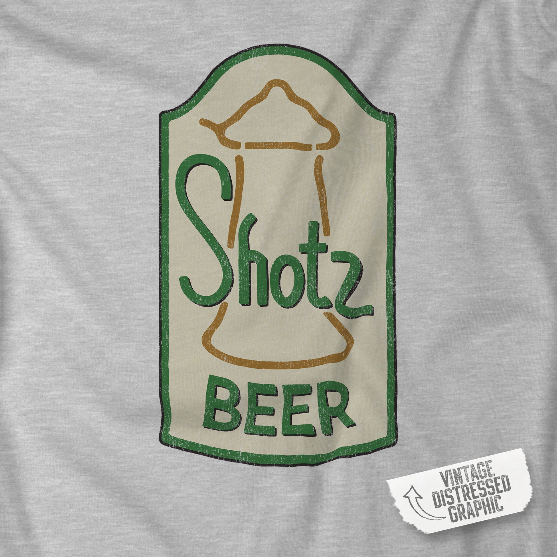 Closeup of Heather grey t-shirt with vintage Shotz Beer Brewery logo graphic, inspired by TV show Laverne & Shirley.