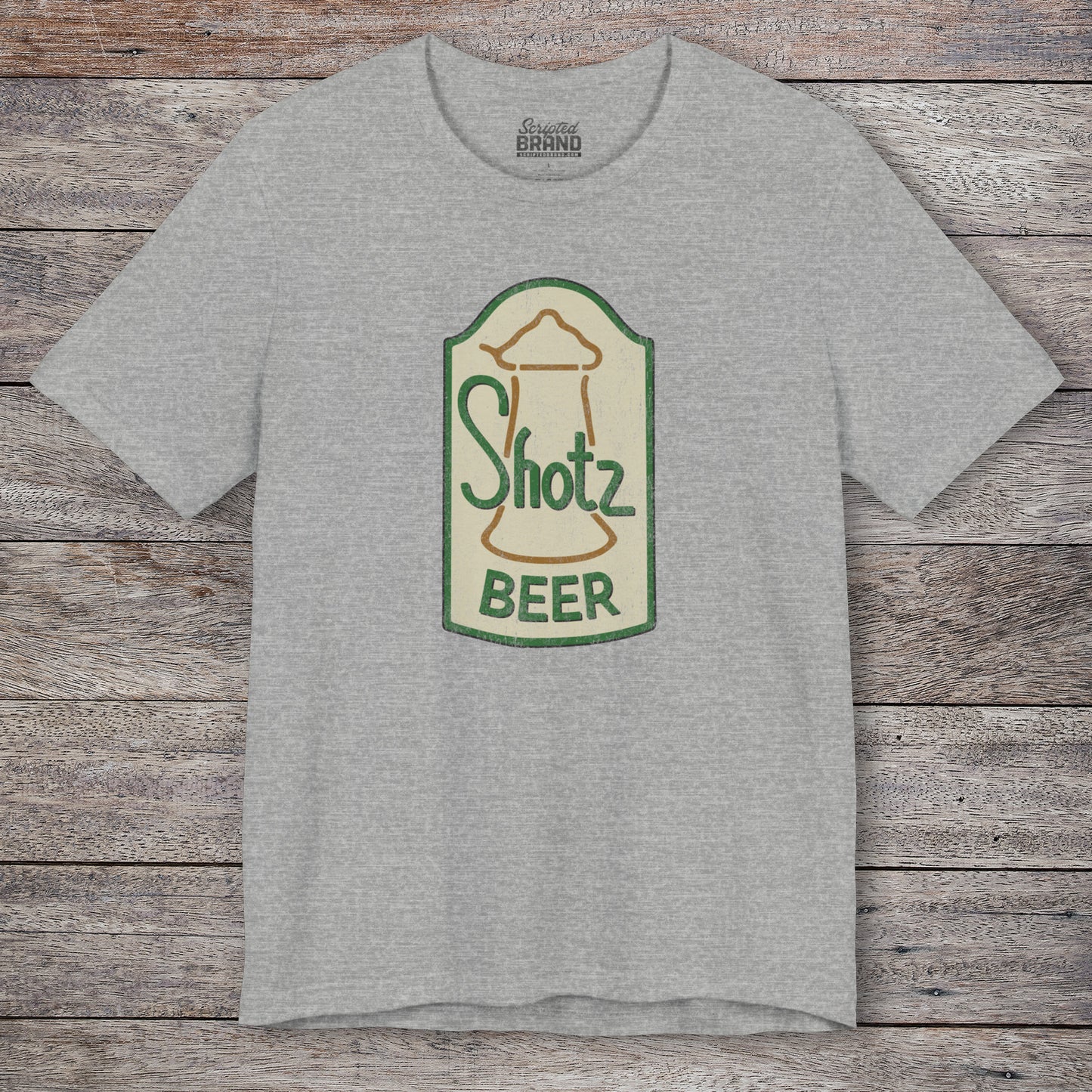 Front view of heather grey t-shirt with vintage Shotz Beer Brewery logo graphic, inspired by TV show Laverne & Shirley.