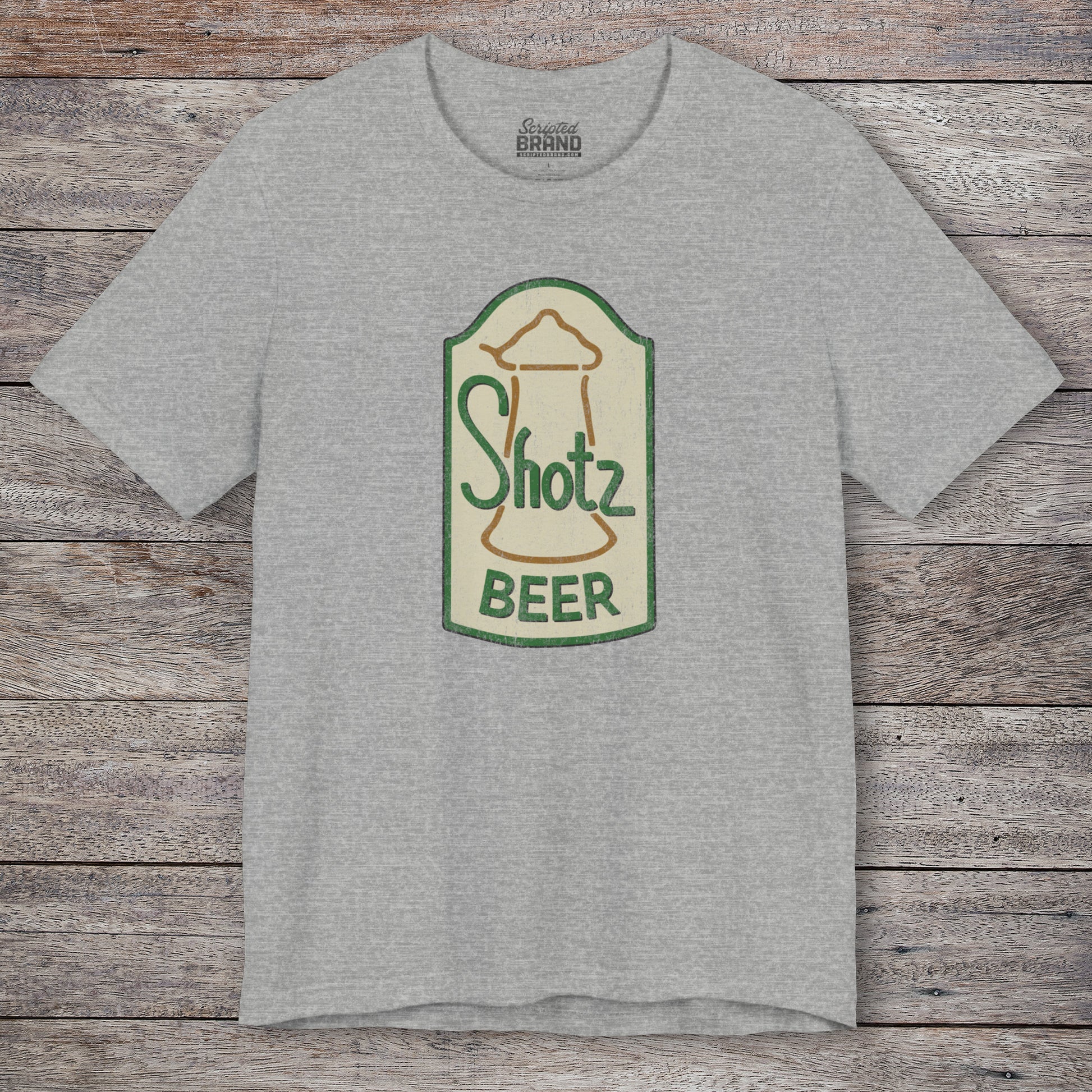 Front view of heather grey t-shirt with vintage Shotz Beer Brewery logo graphic, inspired by TV show Laverne & Shirley.