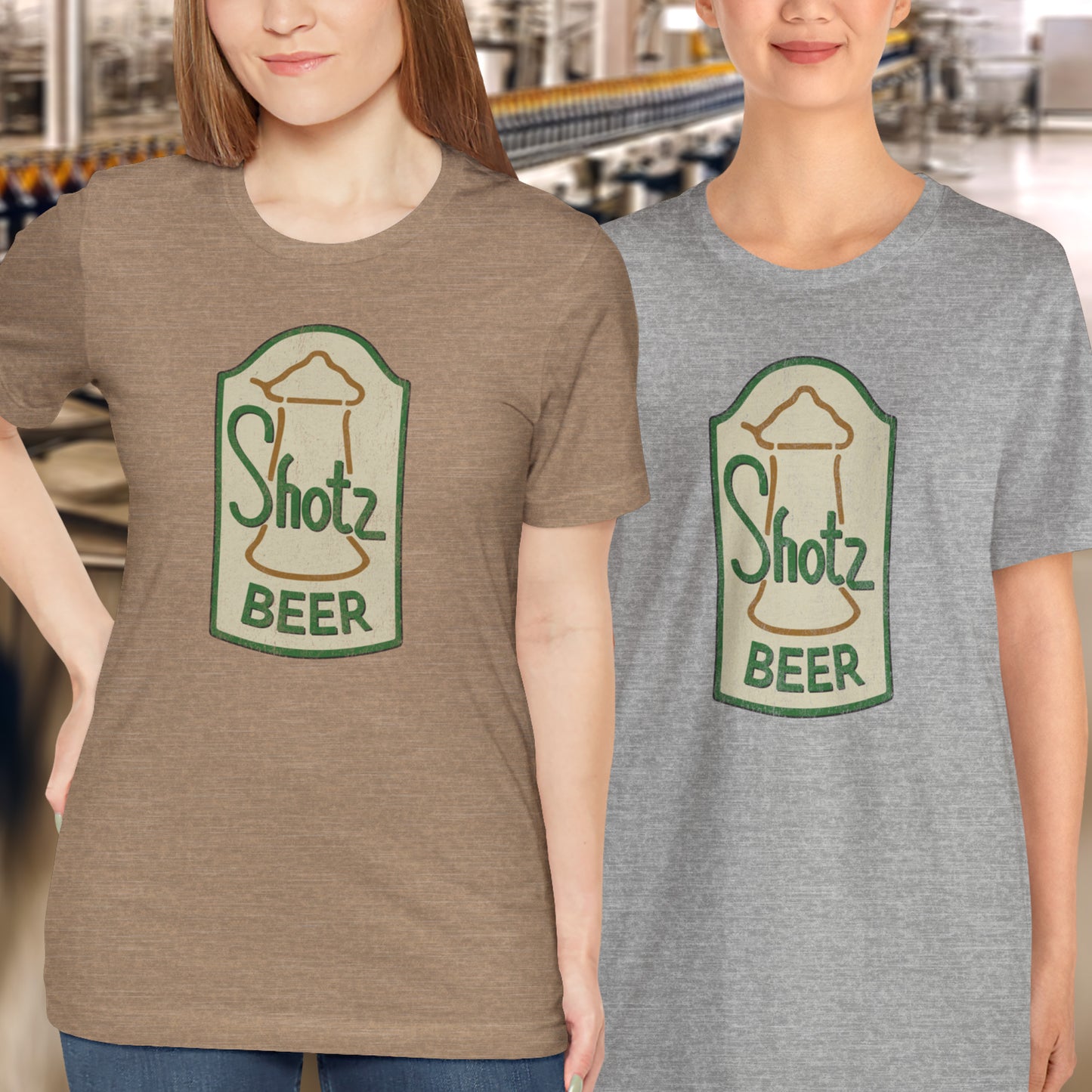 2 female models wearing heather grass green t-shirt with vintage Shotz Beer Brewery logo graphic, inspired by TV show Laverne & Shirley.