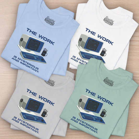 Group of 5 folded Soft Bella+Canvas shirtsleeve t-shirts featuring the retro computer workstation from the Apple TV show Severance, and includes the text The Work is Mysterious and Important. Graphic is designed and illustrated by ScriptedBrand.