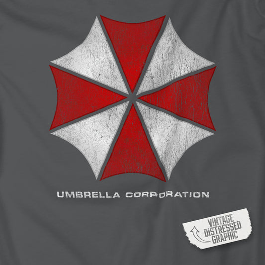 Closeup of asphalt gray t-shirt featuring the Umbrella Corp logo from the video game and movie franchise Resident Evil in a vintage distressed style.