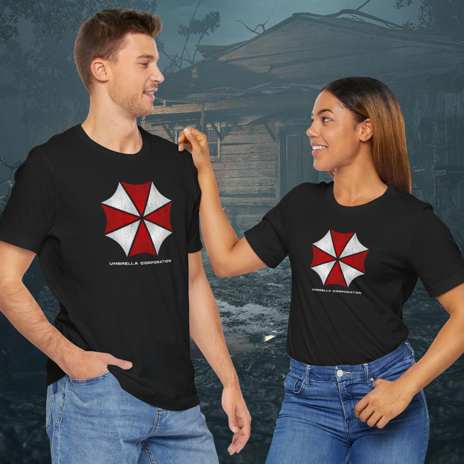 Two people wearing black t-shirts featuring the Umbrella Corp logo from the video game and movie franchise Resident Evil in a vintage distressed style.