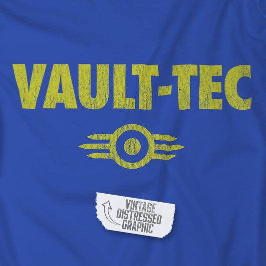 Closeup of Royal blue t-shirt featuring the Vault-Tec logo graphic from the video game Fallout in a vintage distressed style. 