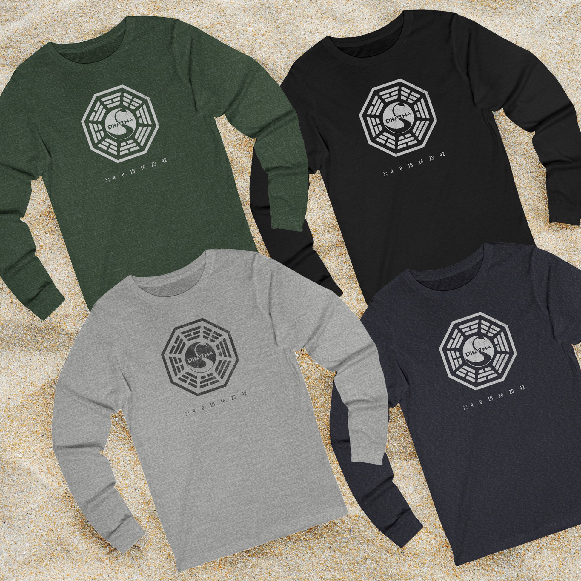 Four long sleeve t-shirts with distressed Dharma Initiative Swan Station logo and hatch numbers from LOST, shown on beach sand