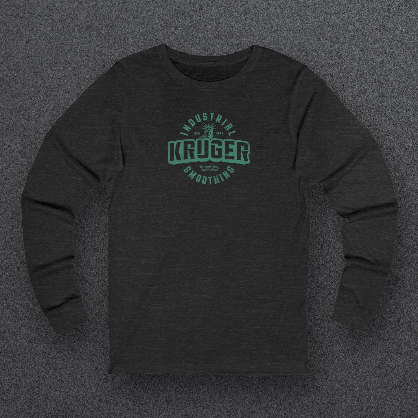 Front view of a deep heather colored soft unisex Bella+Canvas 3501 long-sleeve t-shirt featuring a Kruger Industrial Smoothing logo graphic, designed by ScriptedBrand in a vintage distressed style, and  inspired by the TV show Seinfeld. Includes the Statue of Liberty and the the slogan "We don't care and it shows".