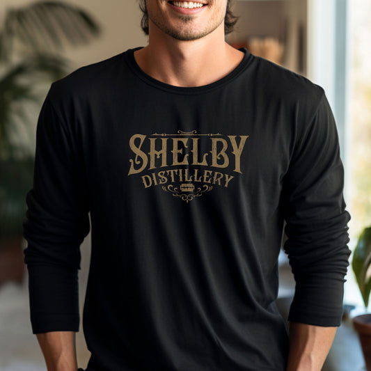 Male model wearing a black Soft Unisex Bella+Canvas 3501 long-sleeve t-shirt featuring a Shelby Company Limited Distillery Logo Graphic inspired by the TV show Peaky Blinders in a vintage distressed style, sold by ScriptedBrand.