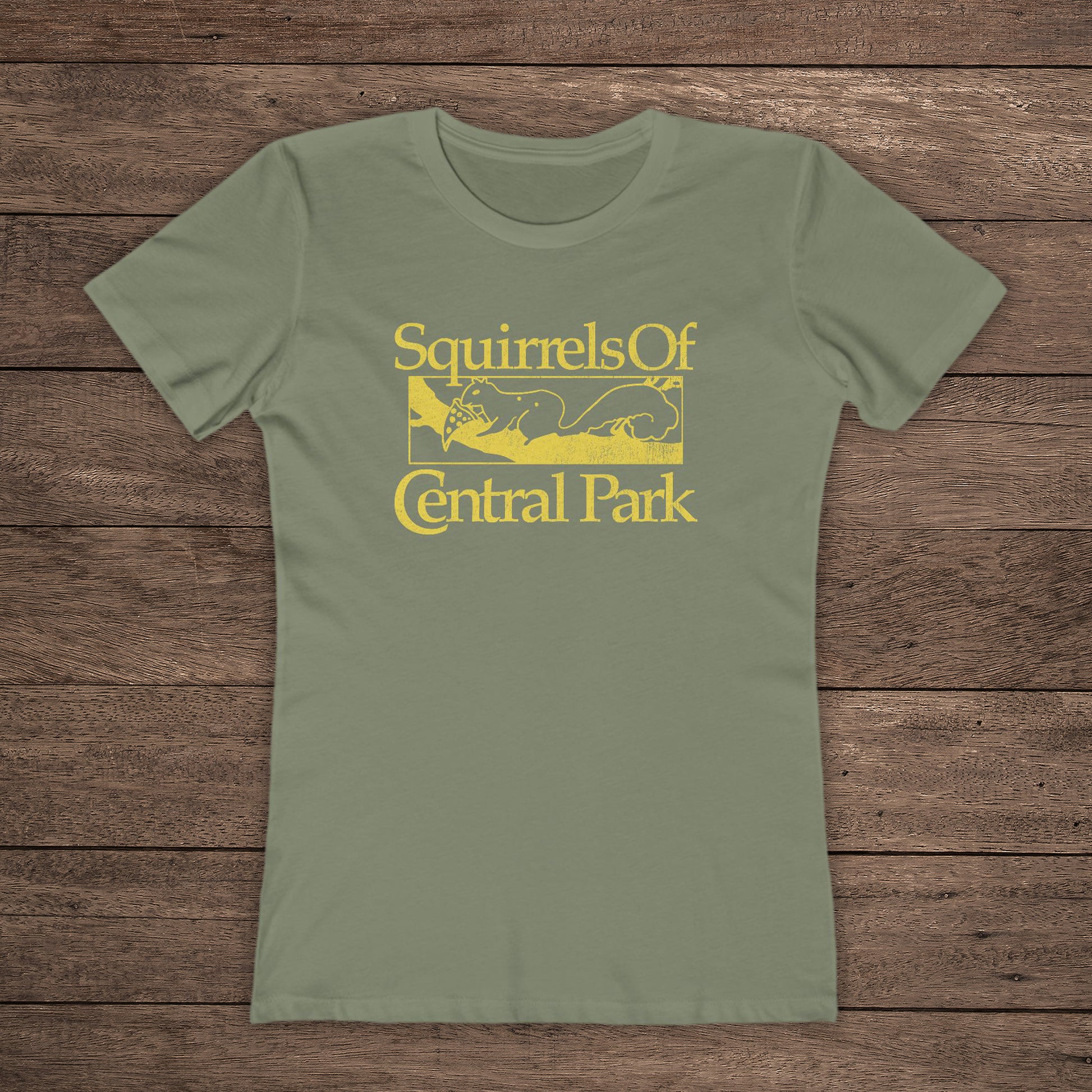 Front view of olive green women’s t-shirt with distressed yellow “Squirrels of Central Park” logo inspired by Bad Sisters.