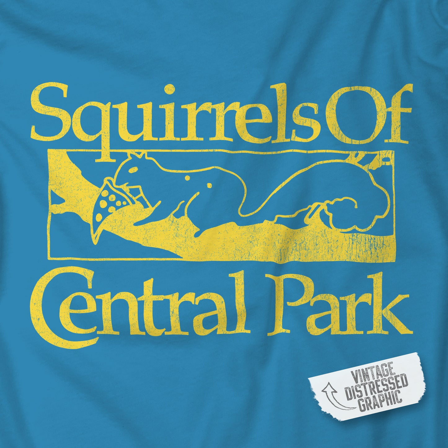 Closeup of Turquoise women’s t-shirt with distressed yellow “Squirrels of Central Park” logo inspired by Bad Sisters.