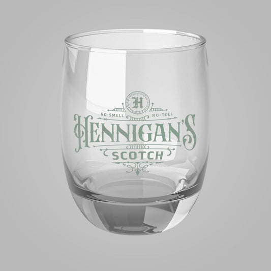Front view of 6 ounce Whiskey Glass with Hennigan's Scotch logo designed by ScriptedBrand from the TV show Seinfeld.