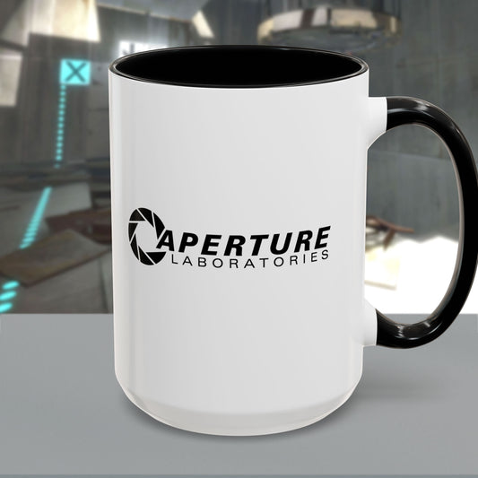 Front view with handle on right of a 15 oz white Ceramic Accent Mug with the black Aperture Laboratories logo from the video game Portal on both sides. Handle and interior are colored black.