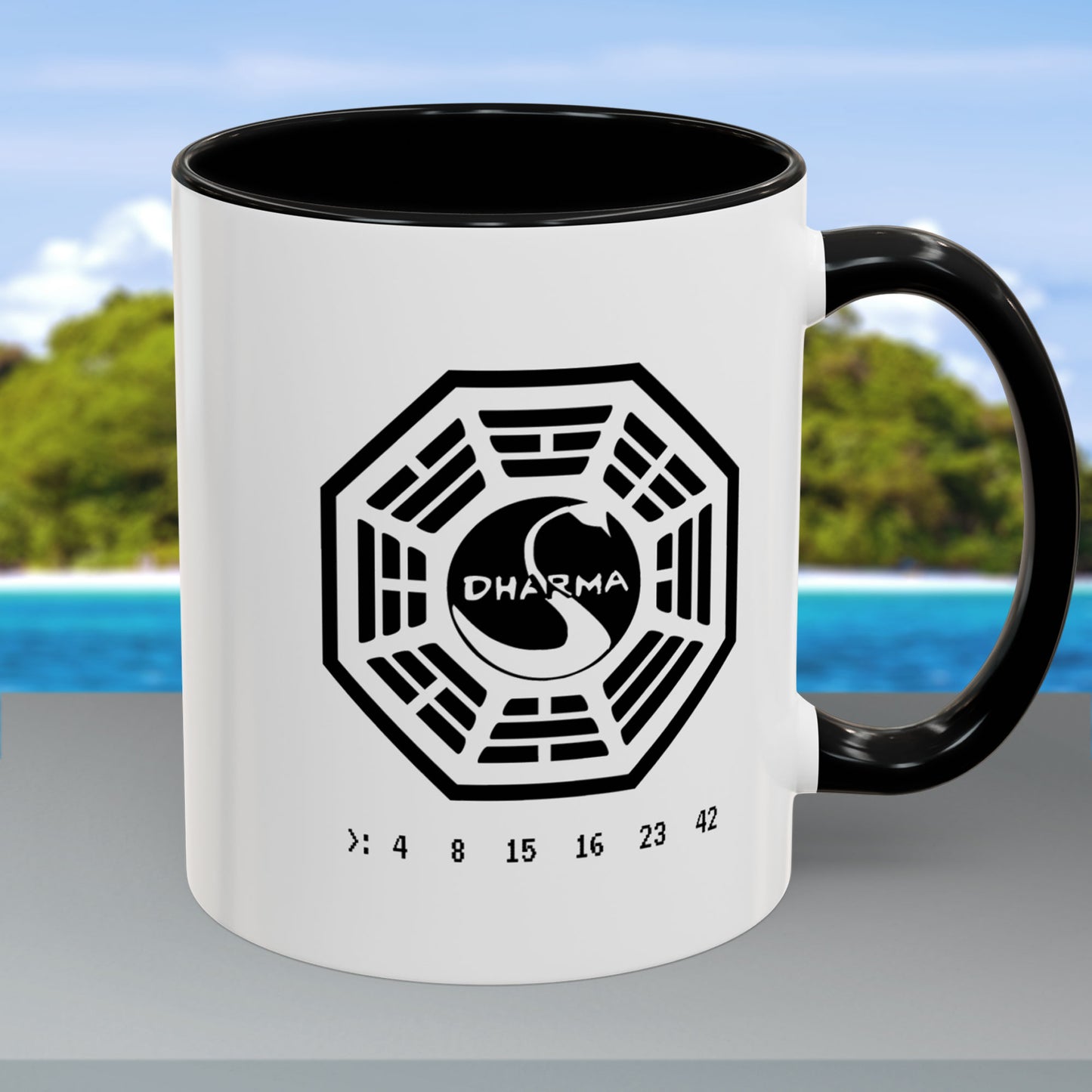 White ceramic Dharma Initiative Swan Station logo mug with black handle and interior, hatch numbers 4 8 15 16 23 42, handle on right