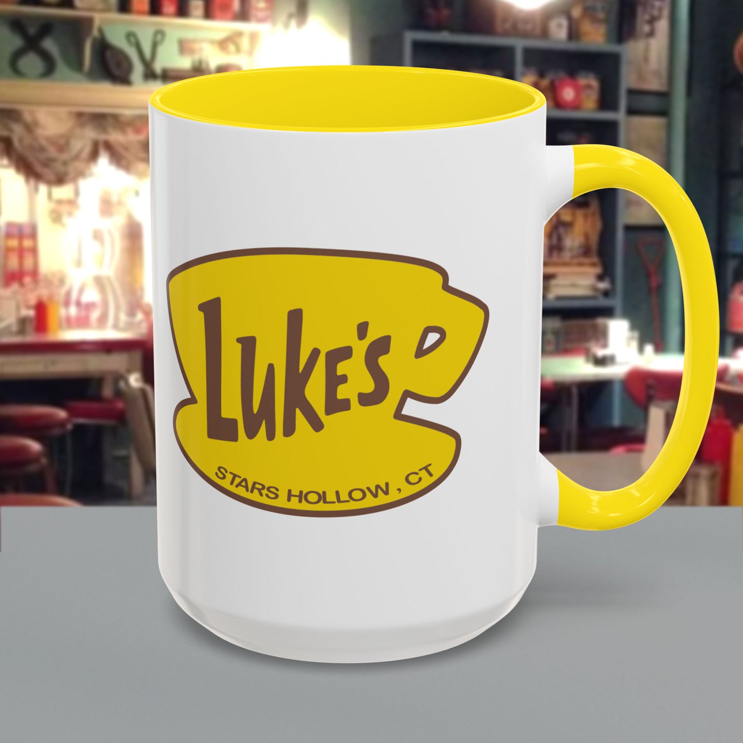 15 oz White ceramic mug with yellow handle and Luke’s Diner logo from Gilmore Girls printed on both sides.