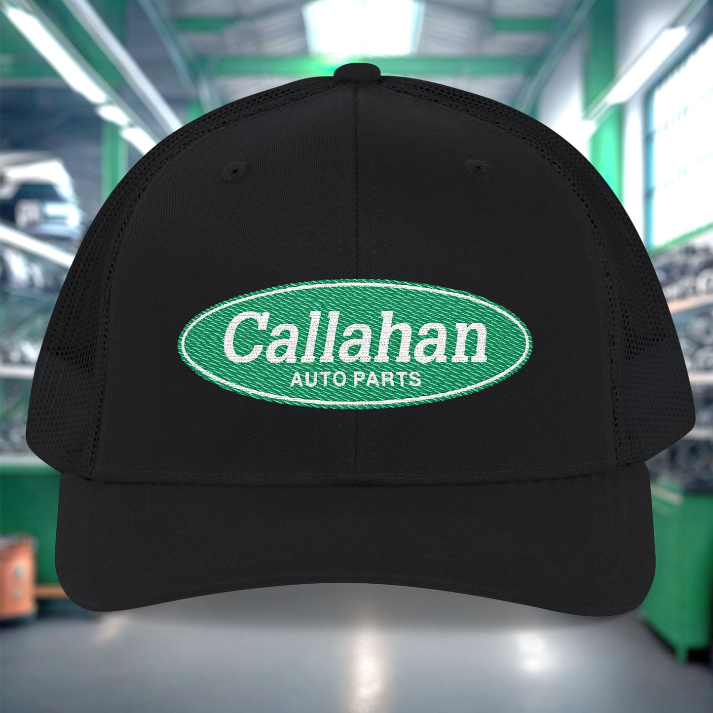 Black cap with Callahan Auto Parts logo in a warehouse setting