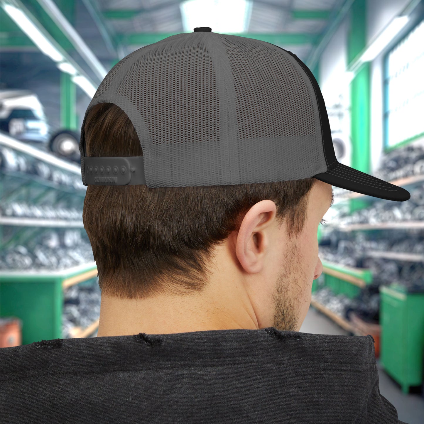 Back view of man wearing a Richardson 112 trucker cap with embroidered green Callahan Auto Parts logo inspired by Tommy Boy.
