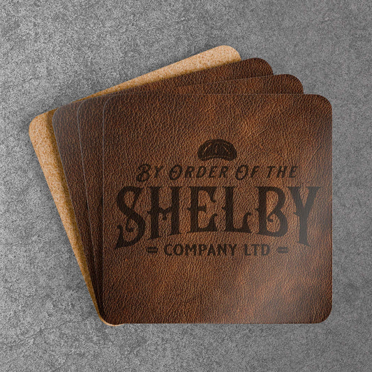 Set of 4 stacked corkwood drink coasters with Shelby Company LTD logo from Peaky Blinders in vintage leather-style print.
